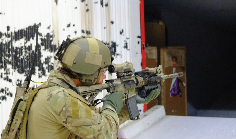 Solider firing rifle in test environment Solider firing rifle in test environment
